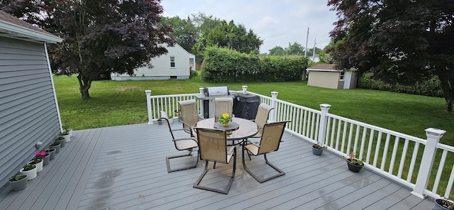 258 Eddy Glover Blvd, New Britain, CT 06053 - wooden deck featuring outdoor dining area and a lawn