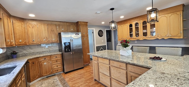 258 Eddy Glover Blvd, New Britain, CT 06053 - kitchen featuring stainless steel appliances, light wood finished floors, light stone counters, recessed lighting, and glass insert cabinets