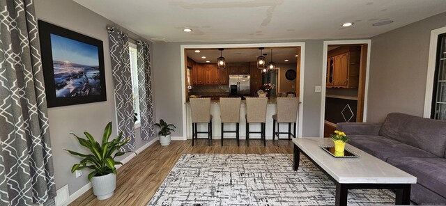 258 Eddy Glover Blvd, New Britain, CT 06053 - living room featuring wood finished floors, recessed lighting, and baseboards