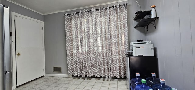 258 Eddy Glover Blvd, New Britain, CT 06053 - unfurnished dining area featuring ornamental molding, tile patterned flooring, and baseboards