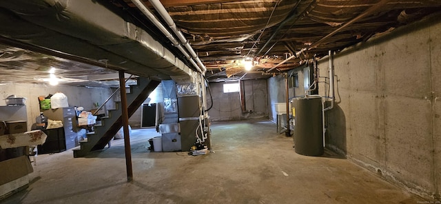 258 Eddy Glover Blvd, New Britain, CT 06053 - basement featuring water heater, heating unit, and stairs