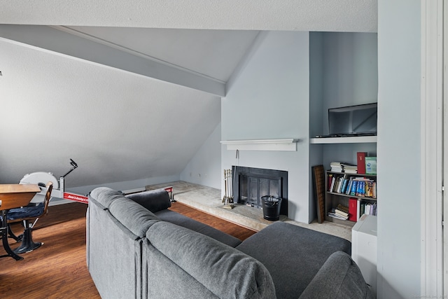 22 River Colony, Guilford, CT 06437 - living area featuring lofted ceiling, a fireplace with raised hearth, and wood finished floors