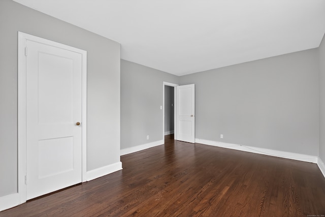 6 Crescent Dr, Danbury, CT 06810 - spare room featuring dark wood-style floors and baseboards