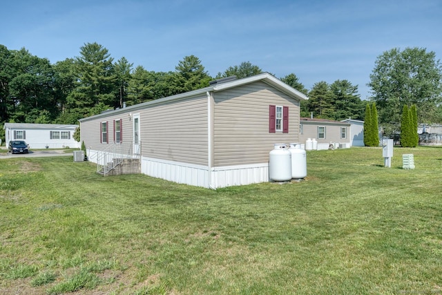 60 Lions Way, Windham, CT 06256 - view of property exterior with entry steps and a yard