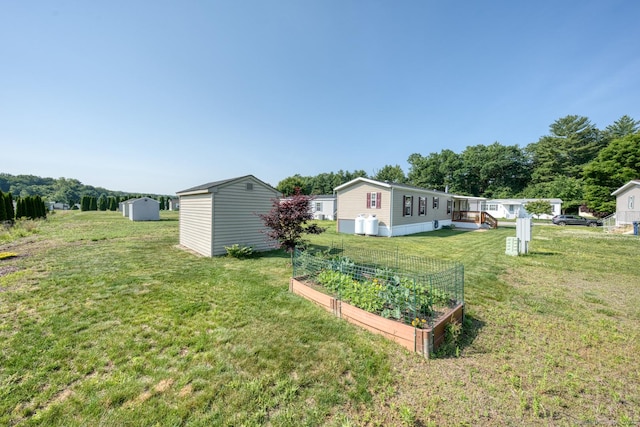 60 Lions Way, Windham, CT 06256 - view of green lawn featuring a shed and a garden