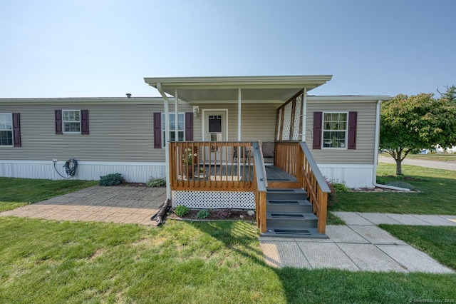 60 Lions Way, Windham, CT 06256 - manufactured / mobile home with a front lawn