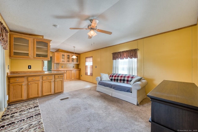 60 Lions Way, Windham, CT 06256 - living area featuring lofted ceiling, ceiling fan, and light carpet