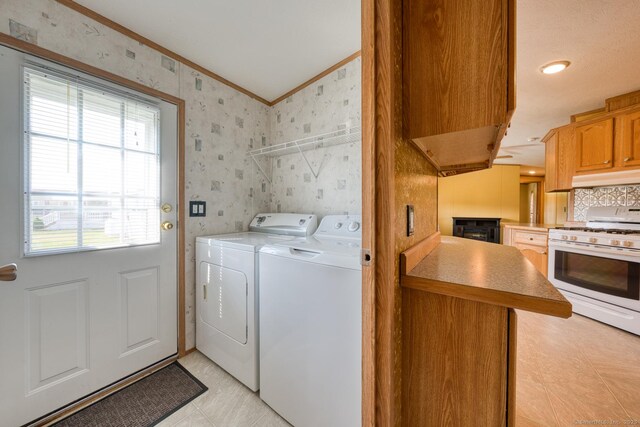 60 Lions Way, Windham, CT 06256 - washroom with washing machine and dryer, crown molding, and wallpapered walls