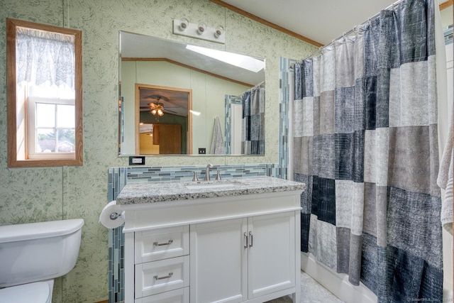 60 Lions Way, Windham, CT 06256 - full bath with vaulted ceiling, wallpapered walls, vanity, ornamental molding, and a ceiling fan