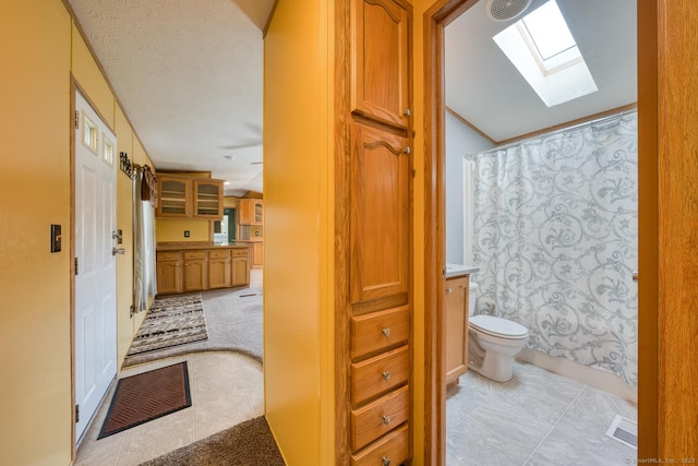 60 Lions Way, Windham, CT 06256 - bathroom featuring a skylight, vanity, a shower with curtain, and tile patterned flooring