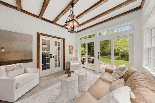 47 Godfrey Rd W, Weston, CT 06883 - living area featuring french doors, wooden walls, and beamed ceiling