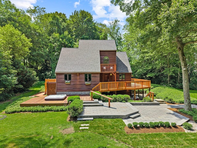 122 Old Post Rd, Old Saybrook, CT 06475 - rear view of house featuring a patio, a wooden deck, a lawn, and a shingled roof