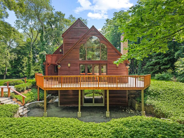 122 Old Post Rd, Old Saybrook, CT 06475 - rear view of house featuring a deck, stairway, and a chimney