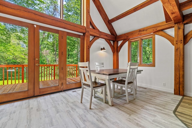 122 Old Post Rd, Old Saybrook, CT 06475 - dining room featuring beamed ceiling, wood finished floors, french doors, and high vaulted ceiling