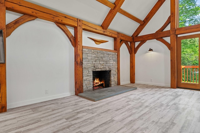 122 Old Post Rd, Old Saybrook, CT 06475 - unfurnished living room featuring beamed ceiling, a fireplace, high vaulted ceiling, and wood finished floors