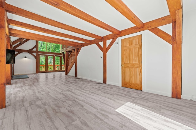 122 Old Post Rd, Old Saybrook, CT 06475 - unfurnished living room featuring beamed ceiling and wood finished floors