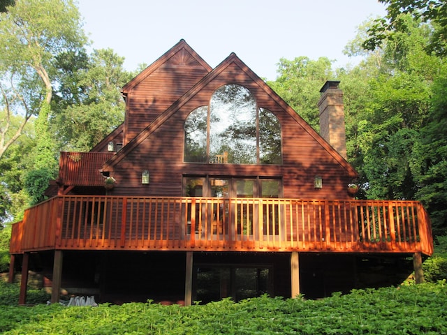 122 Old Post Rd, Old Saybrook, CT 06475 - back of property featuring a wooden deck and a chimney