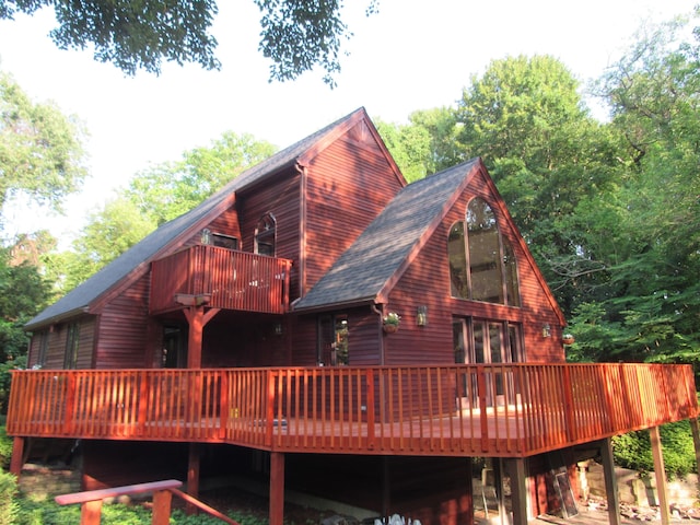 122 Old Post Rd, Old Saybrook, CT 06475 - back of property with roof with shingles, a balcony, and a wooden deck