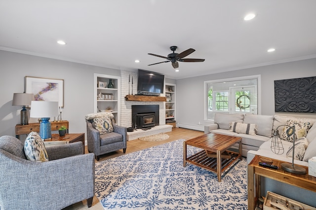 65 Nassahegan Dr, Burlington, CT 06013 - living area featuring a wood stove, recessed lighting, ceiling fan, crown molding, and light wood-style flooring