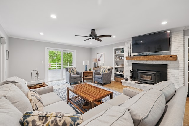 65 Nassahegan Dr, Burlington, CT 06013 - living room with wood finished floors, recessed lighting, a ceiling fan, ornamental molding, and built in shelves