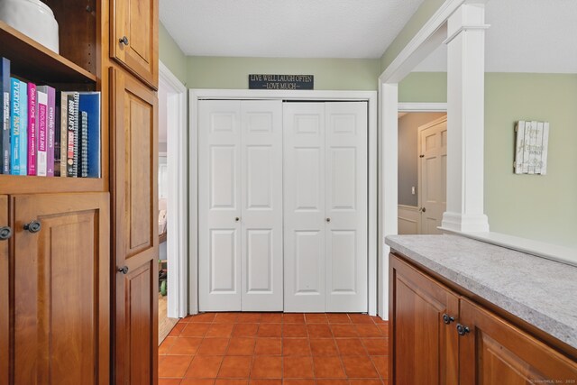 65 Nassahegan Dr, Burlington, CT 06013 - foyer entrance with ornate columns and tile patterned floors