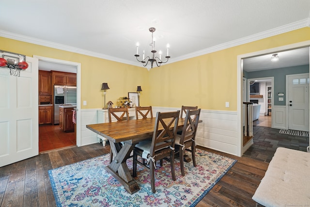 65 Nassahegan Dr, Burlington, CT 06013 - dining space with a wainscoted wall, crown molding, dark wood finished floors, and a chandelier