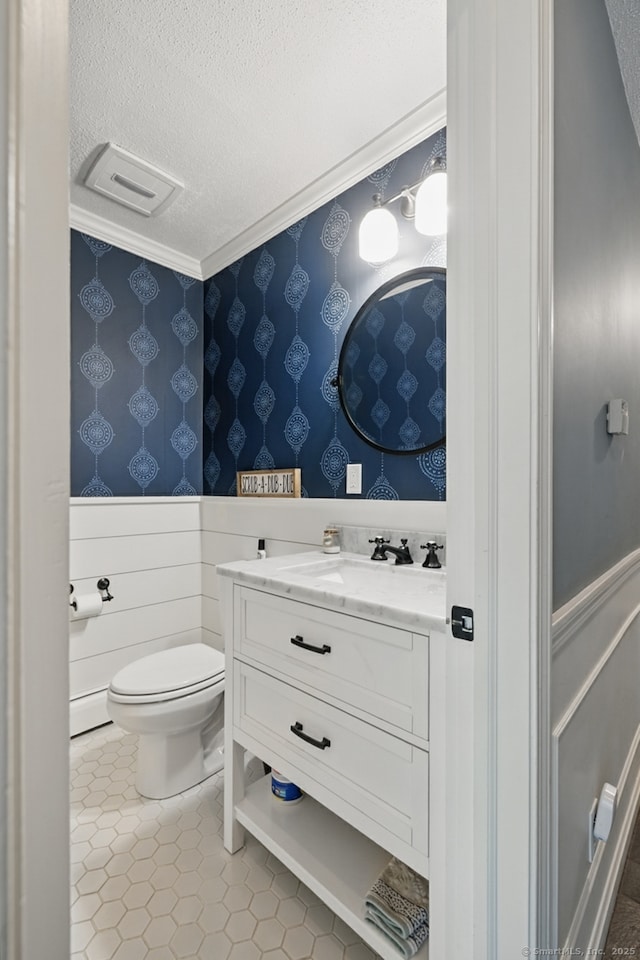65 Nassahegan Dr, Burlington, CT 06013 - bathroom with a textured ceiling, vanity, wainscoting, crown molding, and wallpapered walls