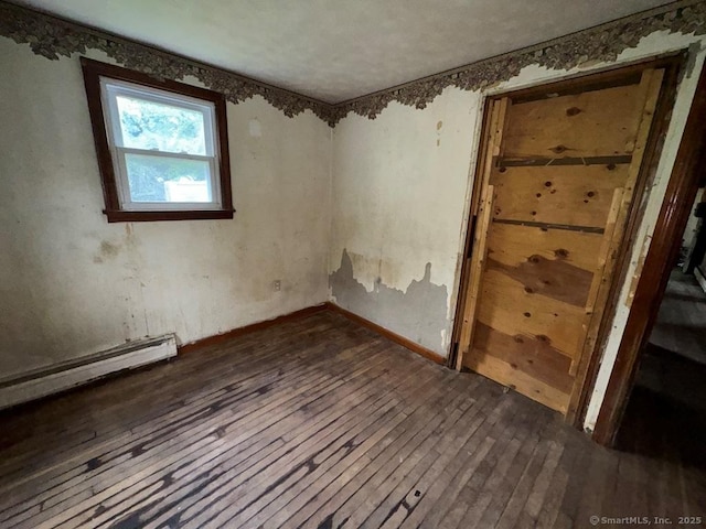 4 Lox Ln, Enfield, CT 06082 - spare room with dark wood-style flooring and baseboard heating