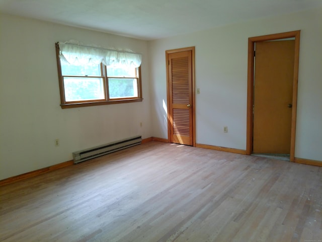 152 Old Mill Rd, Middletown, CT 06457 - spare room with a baseboard radiator and wood finished floors