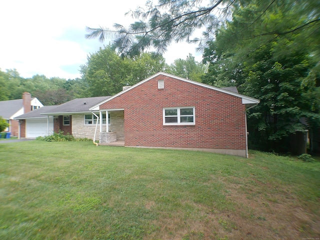 152 Old Mill Rd, Middletown, CT 06457 - view of front of home with brick siding, an attached garage, and a front lawn