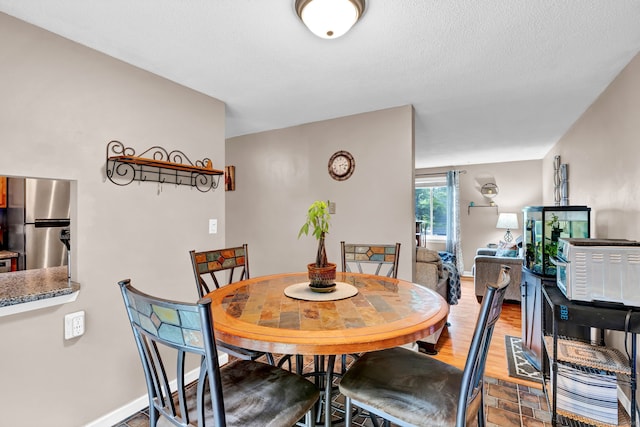 70 Trolley Crossing Ln Unit 70, Middletown, CT 06457 - dining space with wood finished floors and a textured ceiling