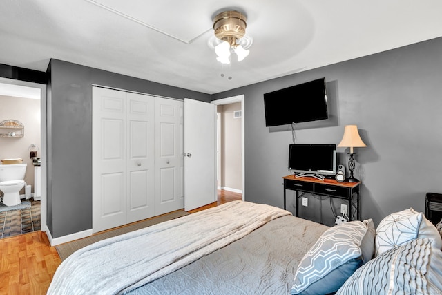 70 Trolley Crossing Ln Unit 70, Middletown, CT 06457 - bedroom with wood finished floors, a closet, a ceiling fan, and connected bathroom