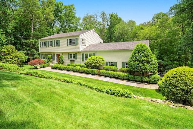 37 Woodridge Cir, New Canaan, CT 06840 - colonial house with a front lawn and a shingled roof