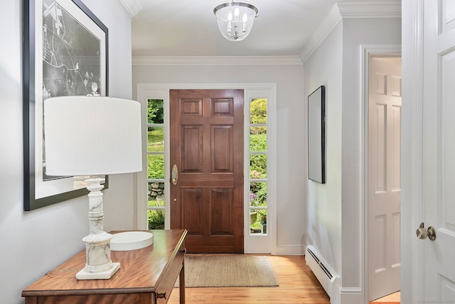 37 Woodridge Cir, New Canaan, CT 06840 - entrance foyer with baseboard heating, light wood-style flooring, crown molding, and a chandelier