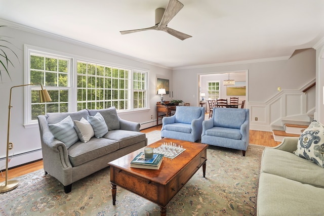 37 Woodridge Cir, New Canaan, CT 06840 - living area featuring a baseboard radiator, ornamental molding, plenty of natural light, and ceiling fan