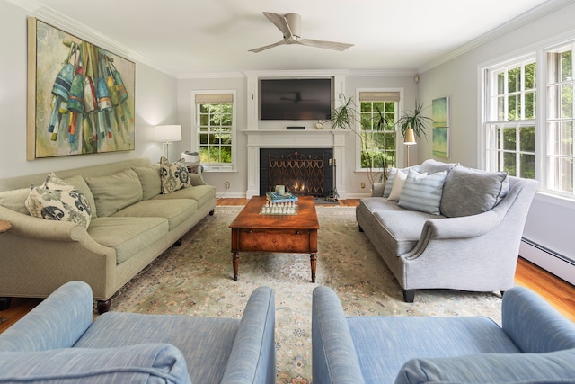 37 Woodridge Cir, New Canaan, CT 06840 - living area with crown molding, healthy amount of natural light, wood finished floors, a ceiling fan, and a fireplace with flush hearth