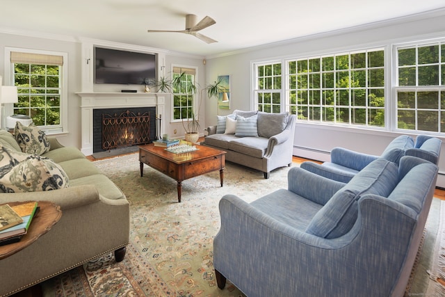 37 Woodridge Cir, New Canaan, CT 06840 - living room featuring baseboard heating, ornamental molding, healthy amount of natural light, a fireplace with flush hearth, and ceiling fan