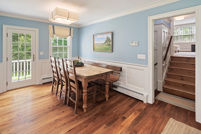 37 Woodridge Cir, New Canaan, CT 06840 - dining room with a wainscoted wall, a baseboard radiator, ornamental molding, stairs, and wood finished floors