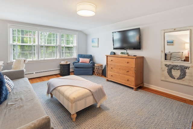 37 Woodridge Cir, New Canaan, CT 06840 - bedroom featuring a baseboard heating unit, light wood-style flooring, multiple windows, and lofted ceiling