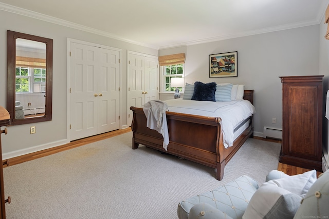 37 Woodridge Cir, New Canaan, CT 06840 - bedroom with baseboard heating, ornamental molding, multiple closets, multiple windows, and light wood-type flooring