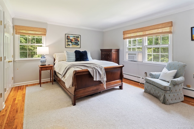 37 Woodridge Cir, New Canaan, CT 06840 - bedroom with baseboard heating, ornamental molding, multiple windows, and wood finished floors