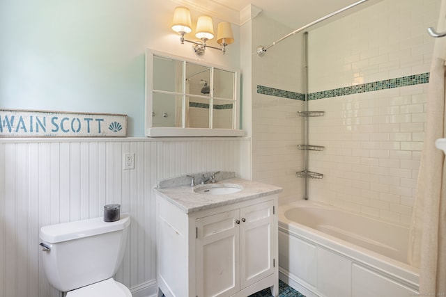 37 Woodridge Cir, New Canaan, CT 06840 - bathroom with tiled shower / bath, vanity, and a wainscoted wall