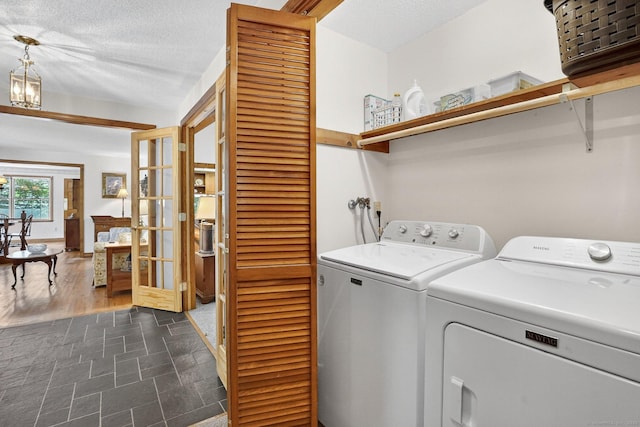 175 Wrights Brook Dr, Somers, CT 06071 - washroom with washing machine and clothes dryer, french doors, and a textured ceiling