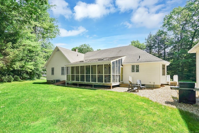 175 Wrights Brook Dr, Somers, CT 06071 - back of house featuring a sunroom, a yard, and roof with shingles