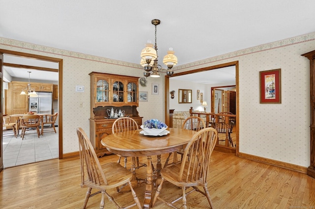 175 Wrights Brook Dr, Somers, CT 06071 - dining area featuring wallpapered walls, a chandelier, and light wood-style flooring