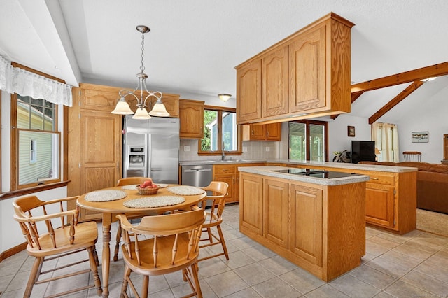 175 Wrights Brook Dr, Somers, CT 06071 - kitchen with appliances with stainless steel finishes, a kitchen island, light countertops, tasteful backsplash, and pendant lighting