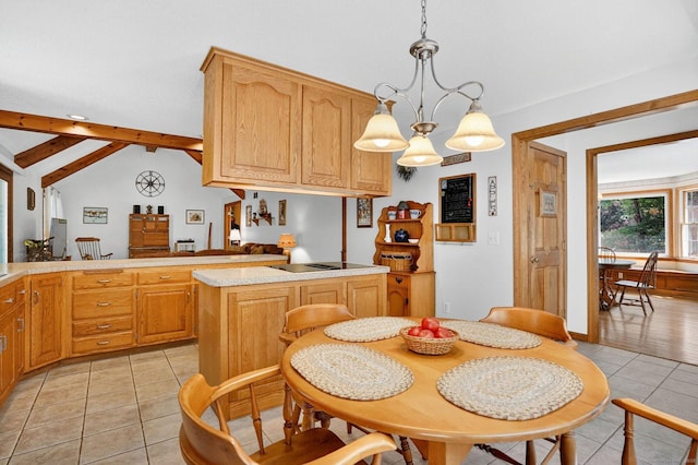 175 Wrights Brook Dr, Somers, CT 06071 - kitchen with light tile patterned floors, a peninsula, light countertops, black electric stovetop, and decorative light fixtures