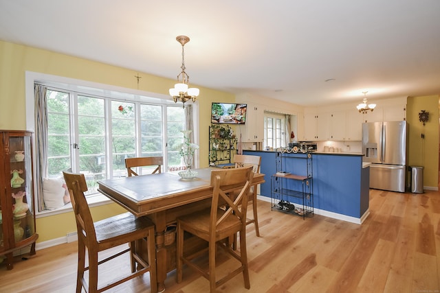 100 Ridgebrook Rd, Torrington, CT 06790 - dining room featuring a chandelier, light wood-style floors, and baseboards