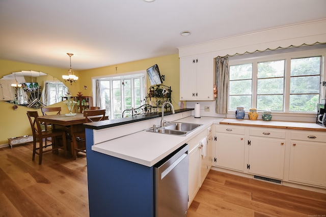 100 Ridgebrook Rd, Torrington, CT 06790 - kitchen with a sink, dishwasher, a peninsula, and light wood-type flooring