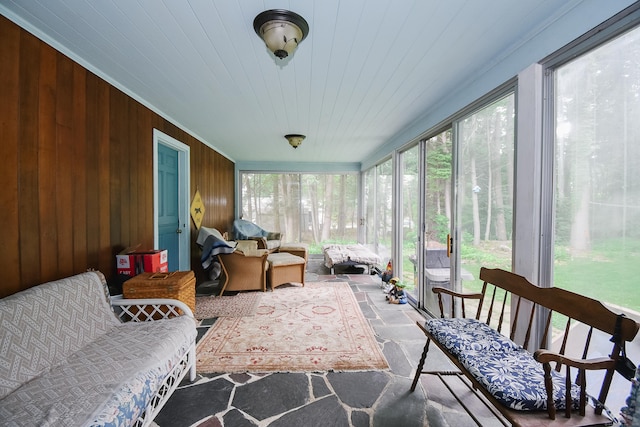100 Ridgebrook Rd, Torrington, CT 06790 - sunroom with stone tile floors, an outdoor hangout area, and wooden walls